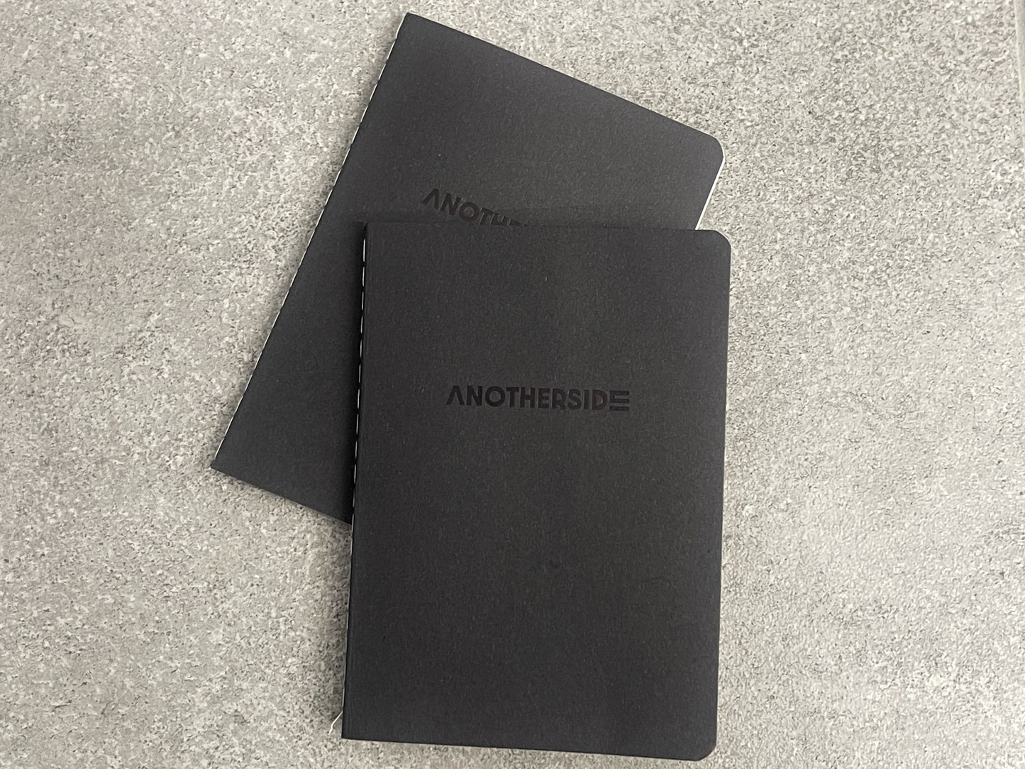 ANOTHERSIDE Notebook
